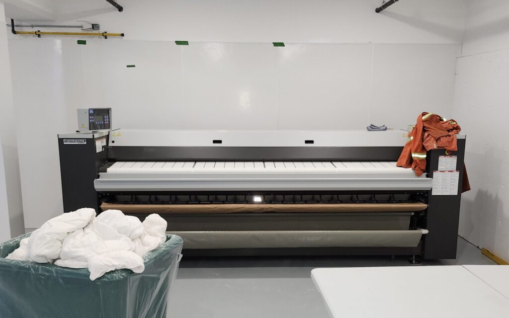 talking about efficiency in flatwork ironers like this one installed by haddon